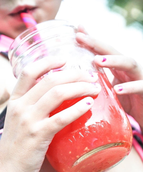 Child Drinking Wild Watermelon Punch from Mason Jar