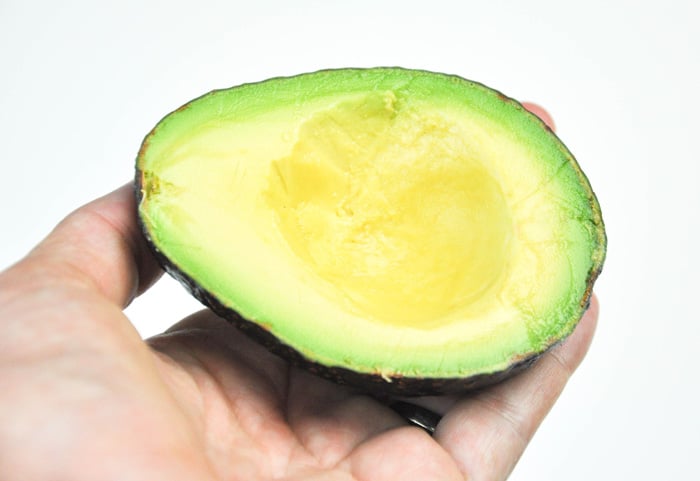 Halved and pitted avocado