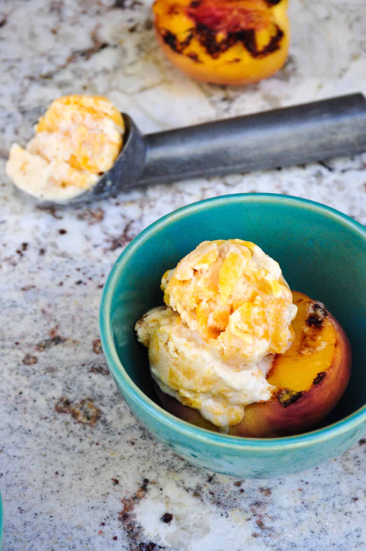 Canned Peach Ice Cream atop Fresh Grilled Peaches